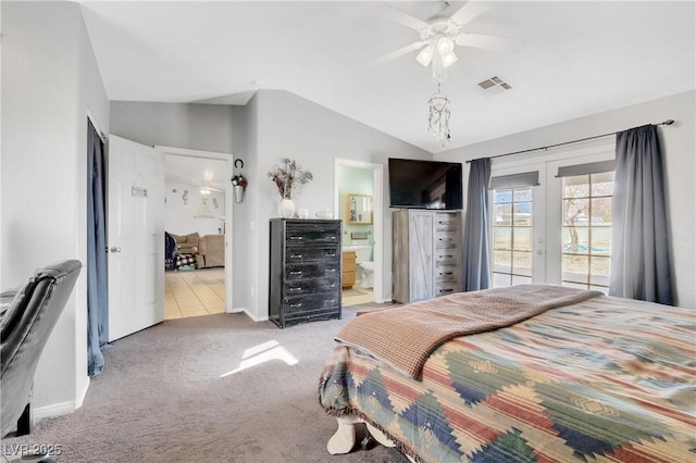 carpeted bedroom with french doors, lofted ceiling, ensuite bathroom, and access to outside