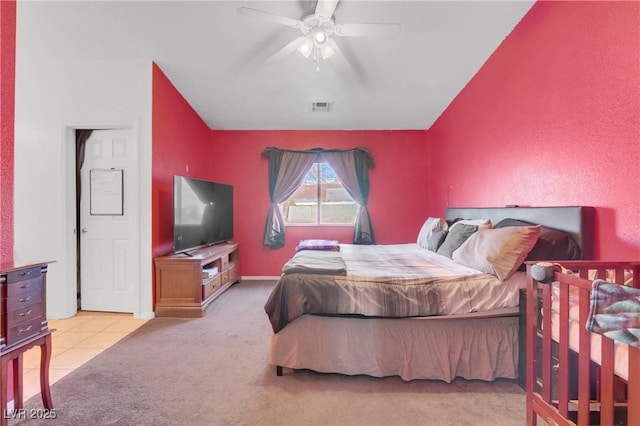 bedroom featuring light colored carpet and ceiling fan