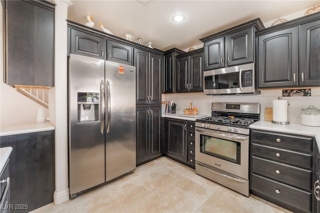 kitchen with stainless steel appliances and light countertops