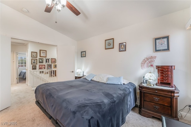 bedroom featuring a ceiling fan, lofted ceiling, and light colored carpet