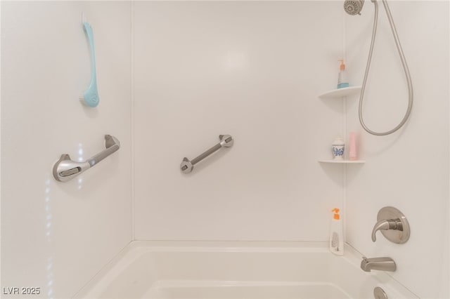 bathroom with shower / washtub combination