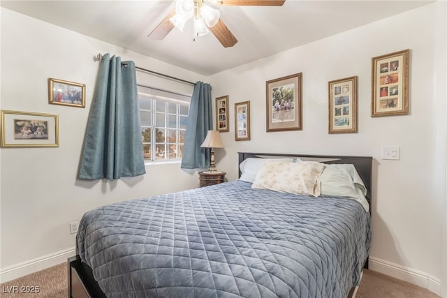 carpeted bedroom with baseboards and ceiling fan