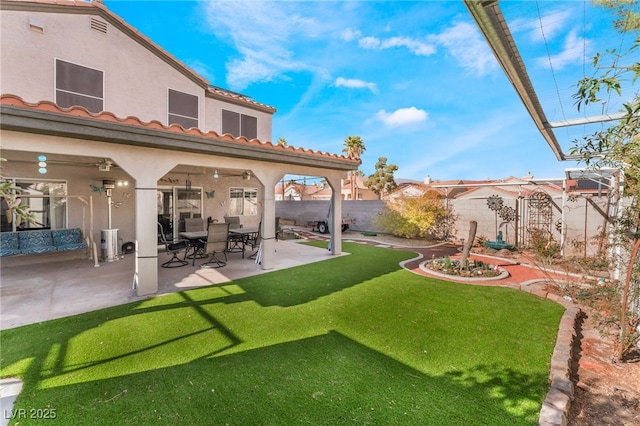 view of yard featuring a patio area and fence