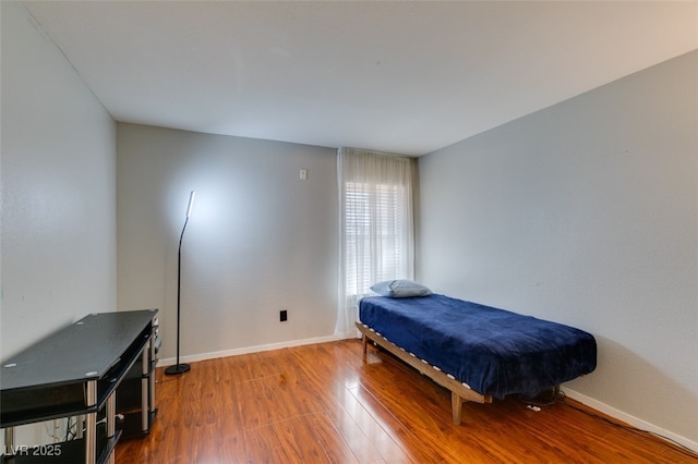 2300 E Silverado Ranch Blvd Unit 2162, Las Vegas, NV 89183 - bedroom featuring wood-type flooring