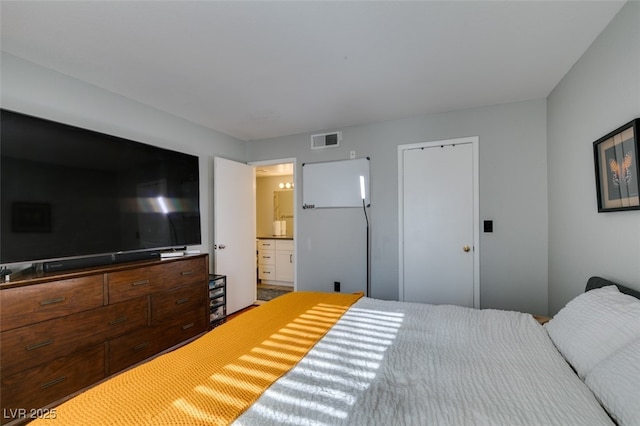 2300 E Silverado Ranch Blvd Unit 2162, Las Vegas, NV 89183 - bedroom with ensuite bathroom and white fridge