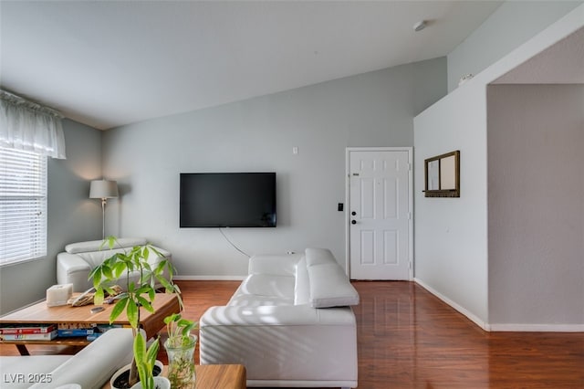 2300 E Silverado Ranch Blvd Unit 2162, Las Vegas, NV 89183 - living room with lofted ceiling and dark hardwood / wood-style floors