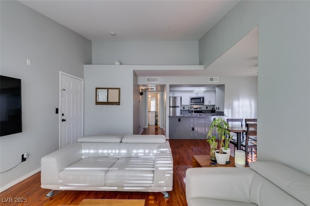 2300 E Silverado Ranch Blvd Unit 2162, Las Vegas, NV 89183 - living room featuring dark hardwood / wood-style floors and sink