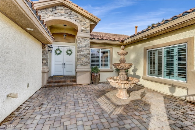 entrance to property featuring french doors