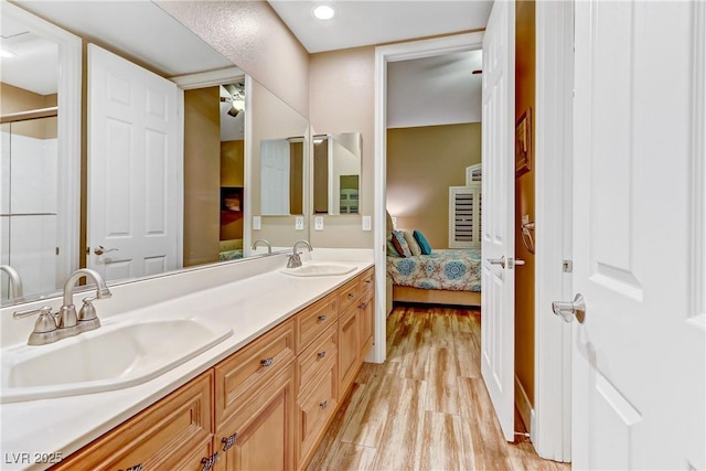 bathroom featuring hardwood / wood-style flooring and vanity