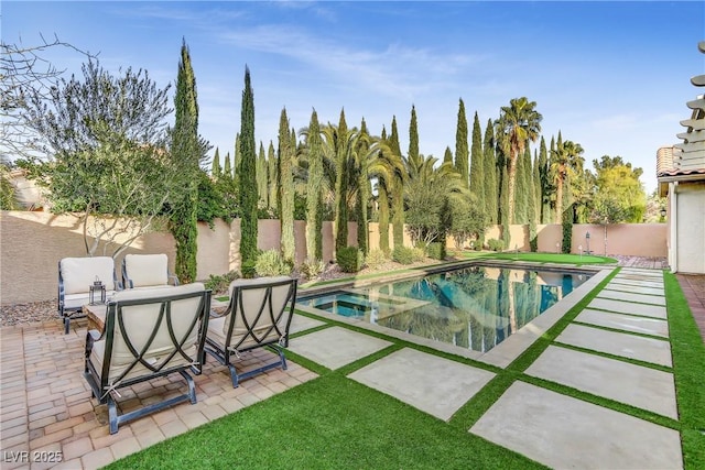 view of pool featuring a patio