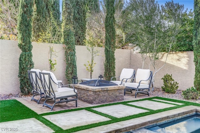 view of patio featuring a fire pit