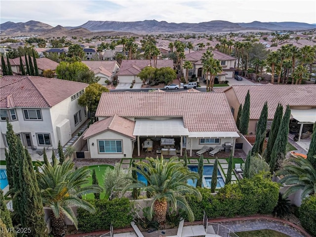 birds eye view of property with a mountain view