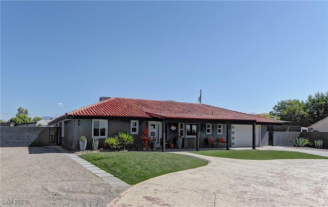 single story home with a garage and a front lawn