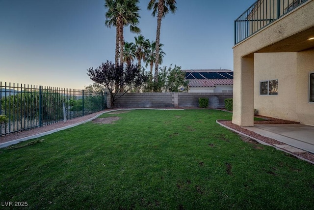 yard at dusk with a balcony