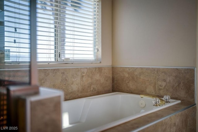 bathroom with tiled tub