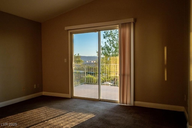 doorway to outside featuring carpet floors and vaulted ceiling