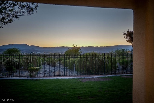 yard at dusk with a mountain view