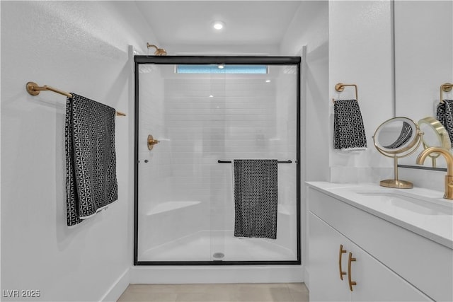 bathroom with vanity and an enclosed shower