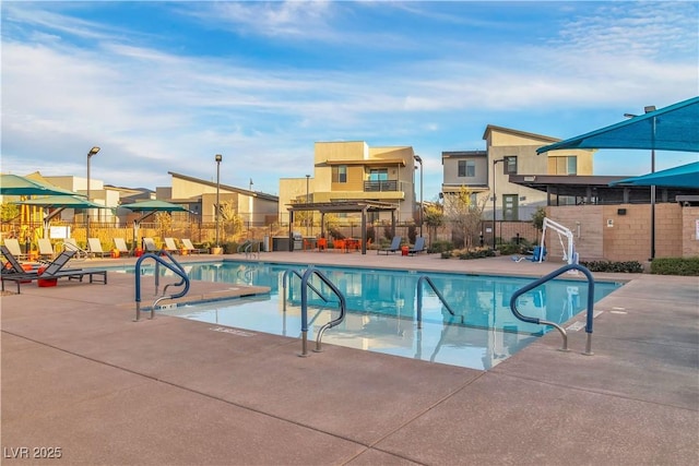 view of swimming pool with a patio area