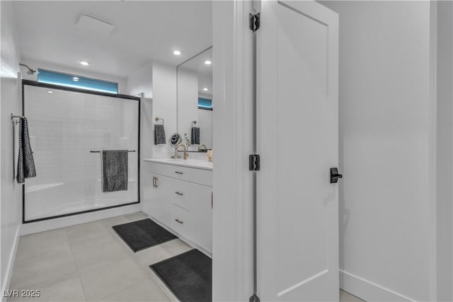 bathroom with tile patterned floors, vanity, and an enclosed shower