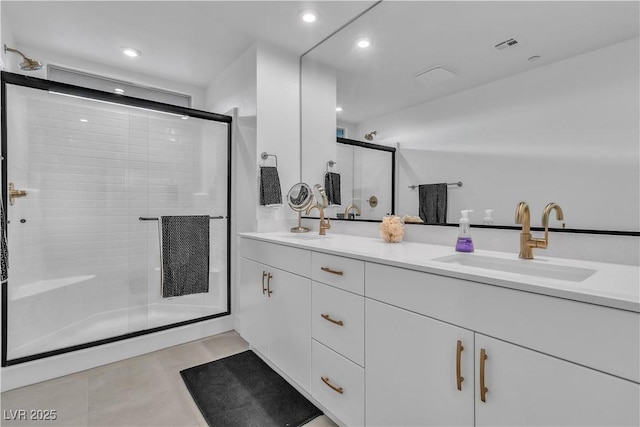 bathroom with vanity and an enclosed shower