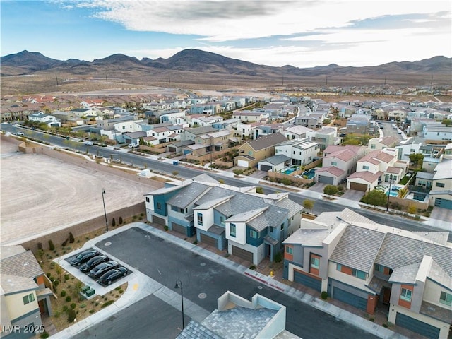 birds eye view of property with a mountain view