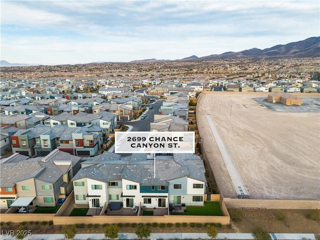 birds eye view of property featuring a mountain view