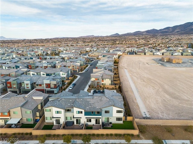 birds eye view of property featuring a mountain view