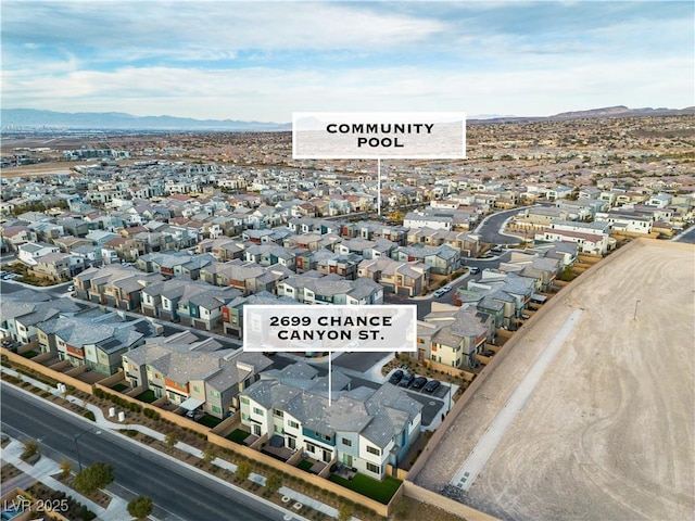 birds eye view of property with a mountain view