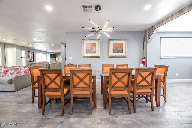 dining room featuring a chandelier