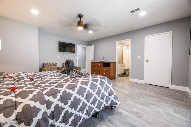 bedroom with connected bathroom, ceiling fan, and light wood-type flooring