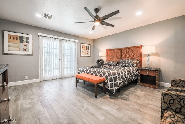 bedroom with ceiling fan, a textured ceiling, access to exterior, and light hardwood / wood-style floors