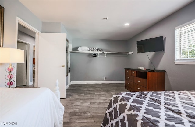 bedroom with wood-type flooring