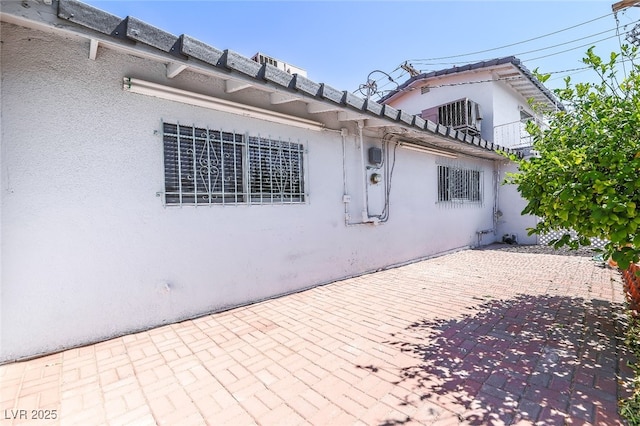 view of side of property featuring a patio