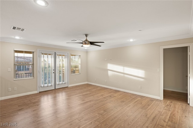 spare room featuring crown molding, ceiling fan, and light hardwood / wood-style floors