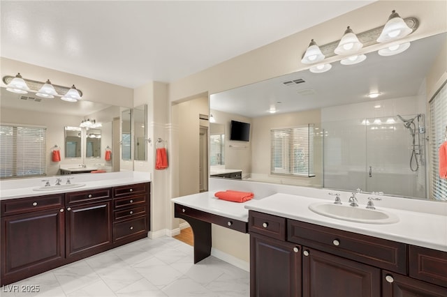 bathroom with vanity and an enclosed shower