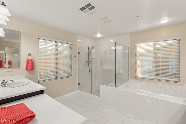 bathroom featuring vanity and plus walk in shower