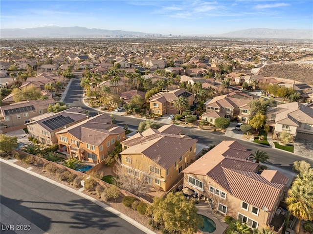 birds eye view of property with a mountain view