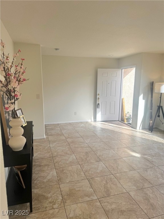 foyer featuring light tile patterned floors