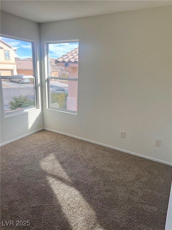 empty room featuring carpet flooring