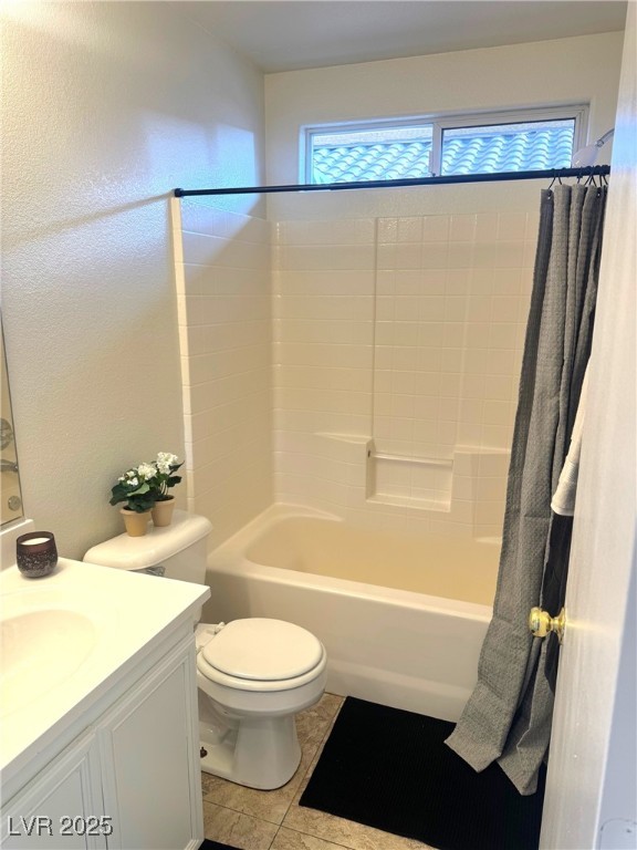 full bathroom featuring shower / bathtub combination with curtain, vanity, and toilet