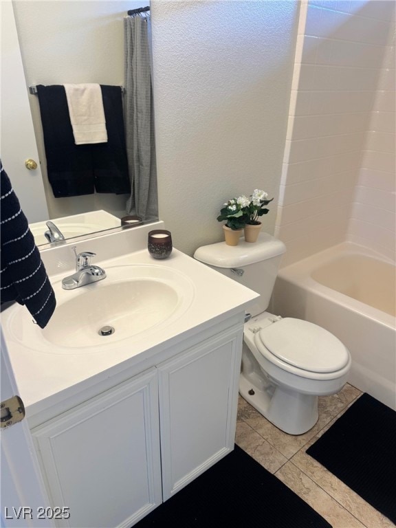 full bathroom featuring vanity, tile patterned flooring, toilet, and shower / bath combo with shower curtain