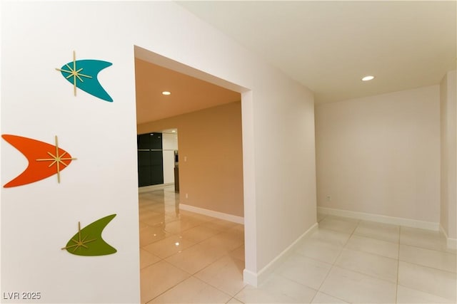 hallway featuring light tile patterned floors