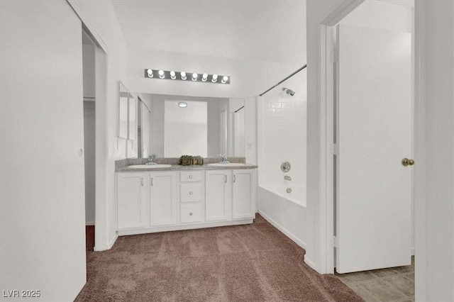 bathroom featuring vanity and shower / bath combination