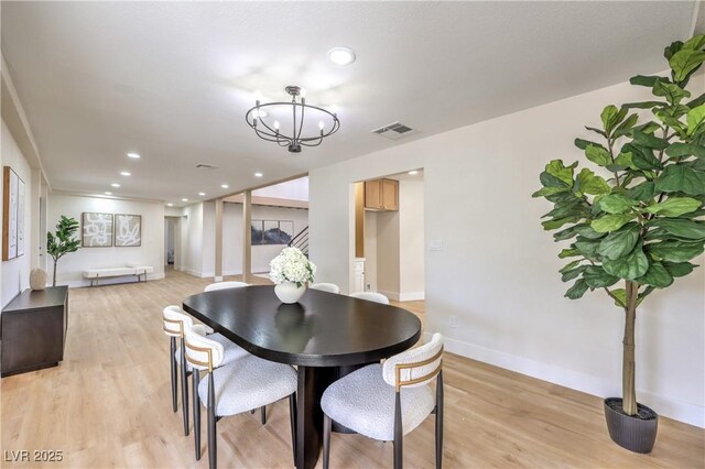 dining room with a chandelier, recessed lighting, visible vents, baseboards, and light wood finished floors