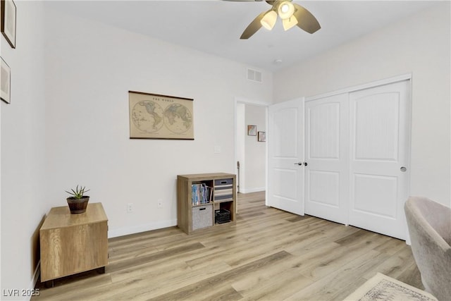 interior space with light hardwood / wood-style flooring and ceiling fan