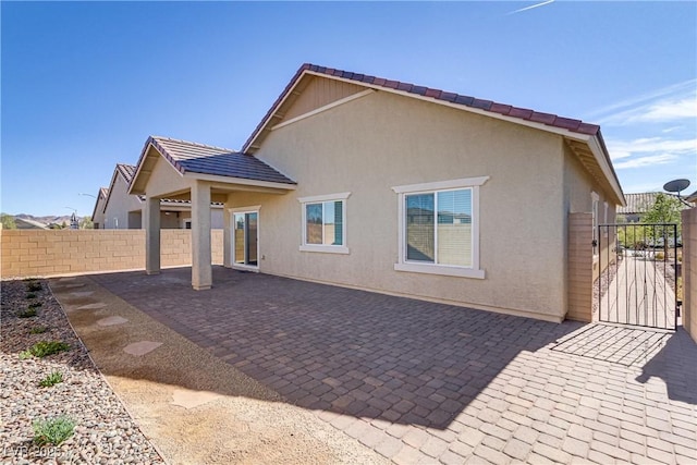 back of property with a patio area