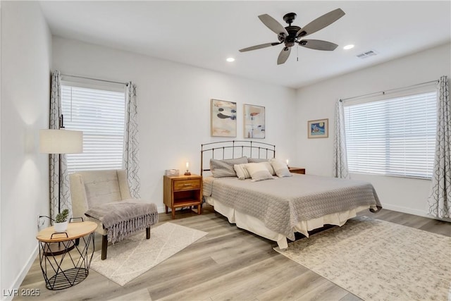 bedroom featuring wood-type flooring and ceiling fan