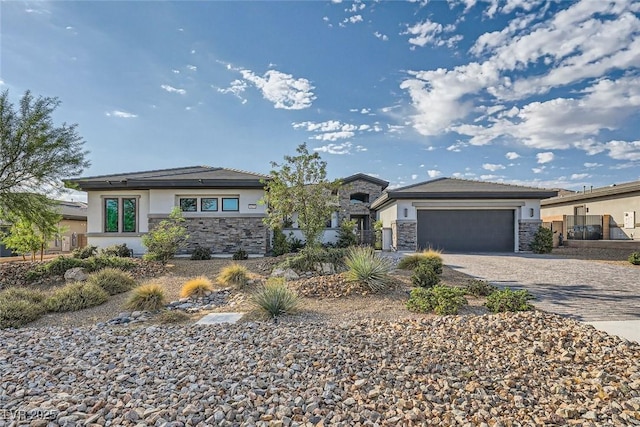 prairie-style home featuring a garage