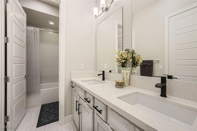 bathroom featuring vanity and shower / bath combo